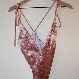 Laura’s boutique pink velvet body suit.